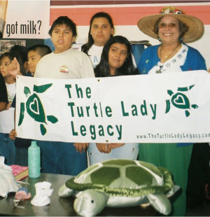 Mary Ann Tous Delights Schoolchildren with Presentation About Ila The Turtle Lady